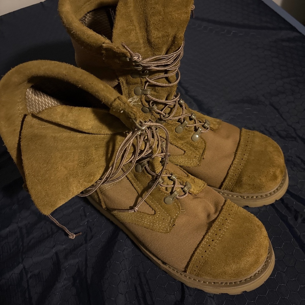 A pair of lightly used military steel toe boots